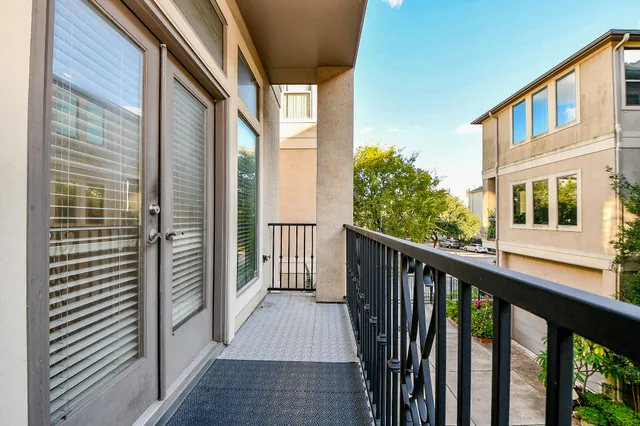 a view of a balcony with wooden floor