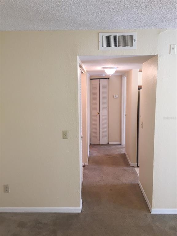 1021 South Hiawassee Road, Unit 3914 Orlando, FL 32835 - Photo 3 of 6 a view of a hallway with closet