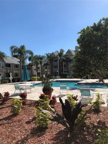 a view of a swimming pool with a patio