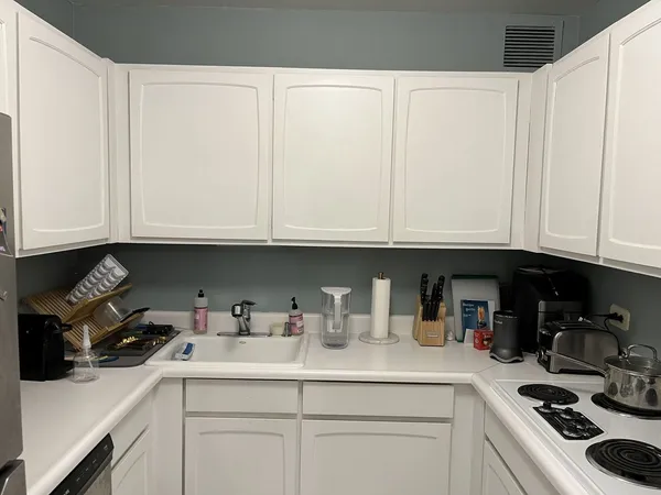 a refrigerator freezer sitting inside of a kitchen