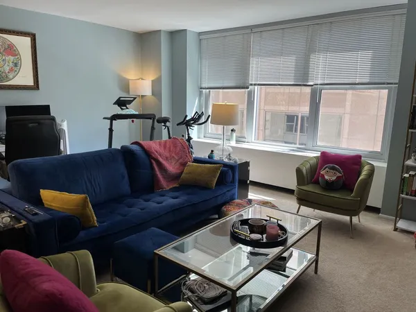 a living room with furniture and a window