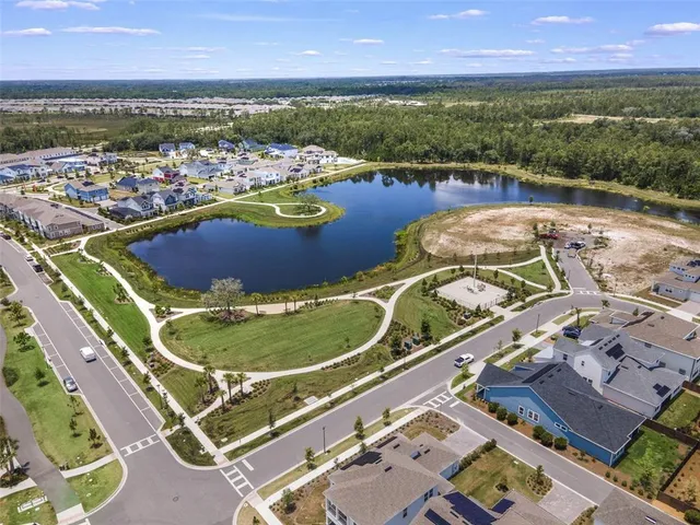 an aerial view of a city with lawn chairs