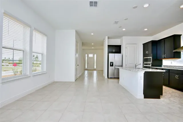 a view of a kitchen with furniture and a window