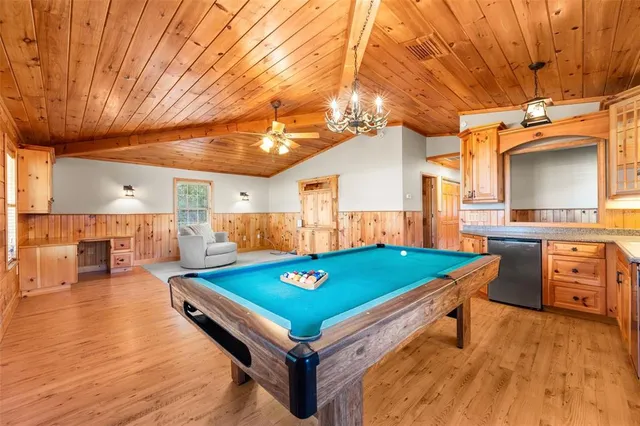a view of a porch with furniture and floor to ceiling window