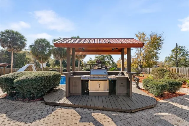 an aerial view of residential house with outdoor space and swimming pool