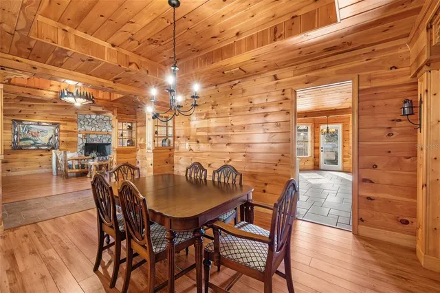 a dining room with furniture and wooden floor
