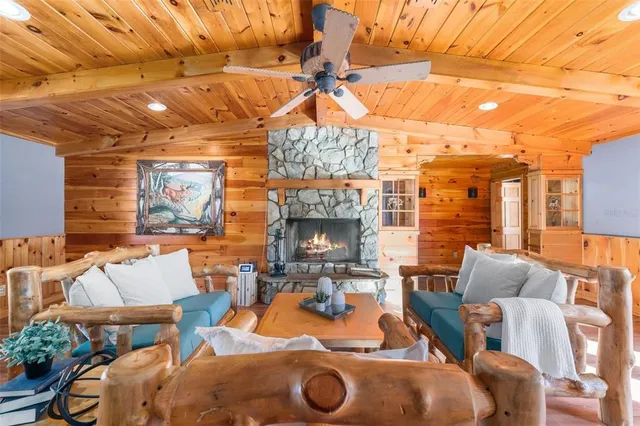 a outdoor space with patio furniture and a fireplace