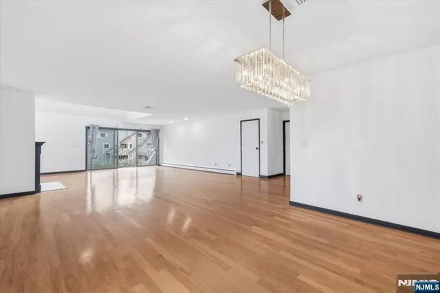 a open kitchen with a large window and kitchen view