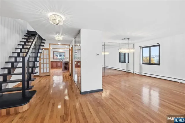 a kitchen with stainless steel appliances a refrigerator and a stove top oven