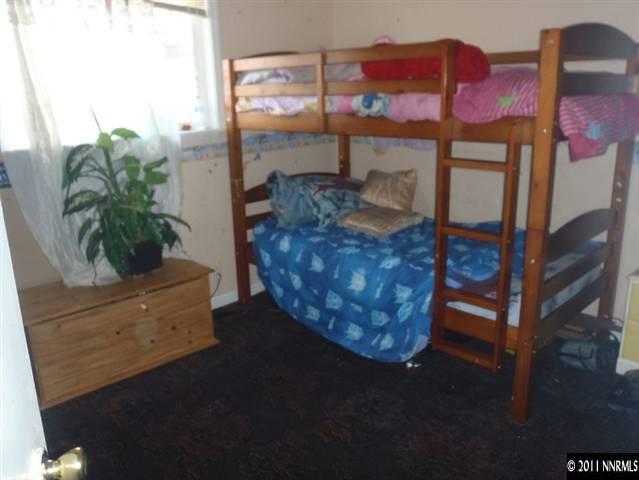 1801 Haddock Drive Reno, NV 89512 - Photo 6 of 10 a room with pool table and potted plant