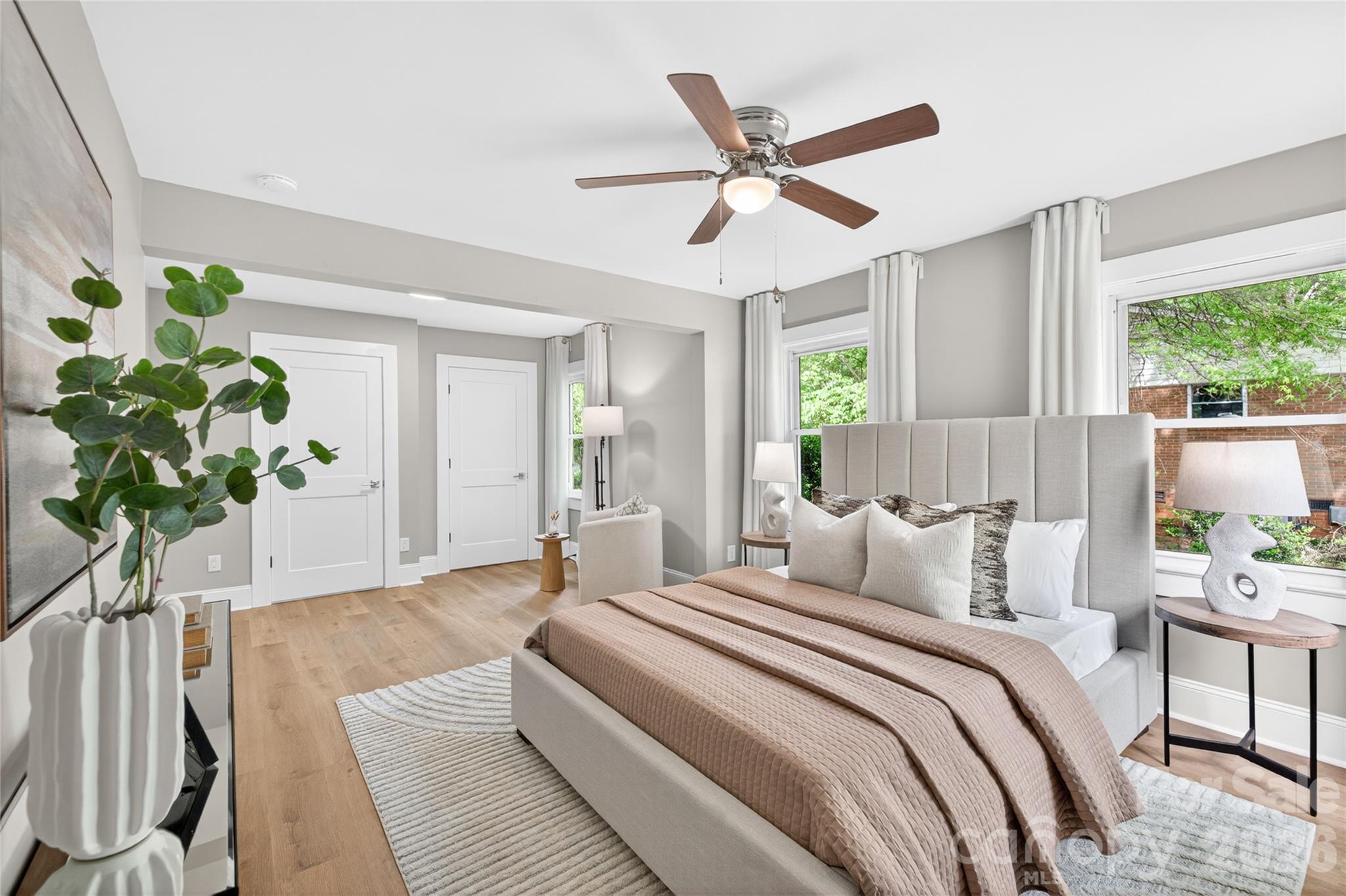 116 Middleton Avenue Matthews, NC 28104 - Photo 12 of 22 a bedroom with a bed and a potted plant