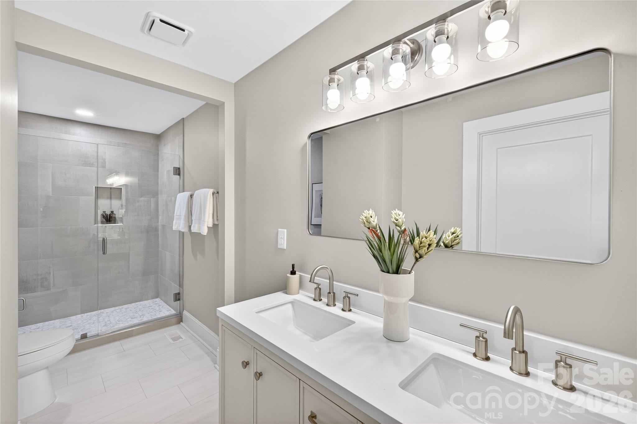 116 Middleton Avenue Matthews, NC 28104 - Photo 13 of 22 a bathroom with a sink and a mirror