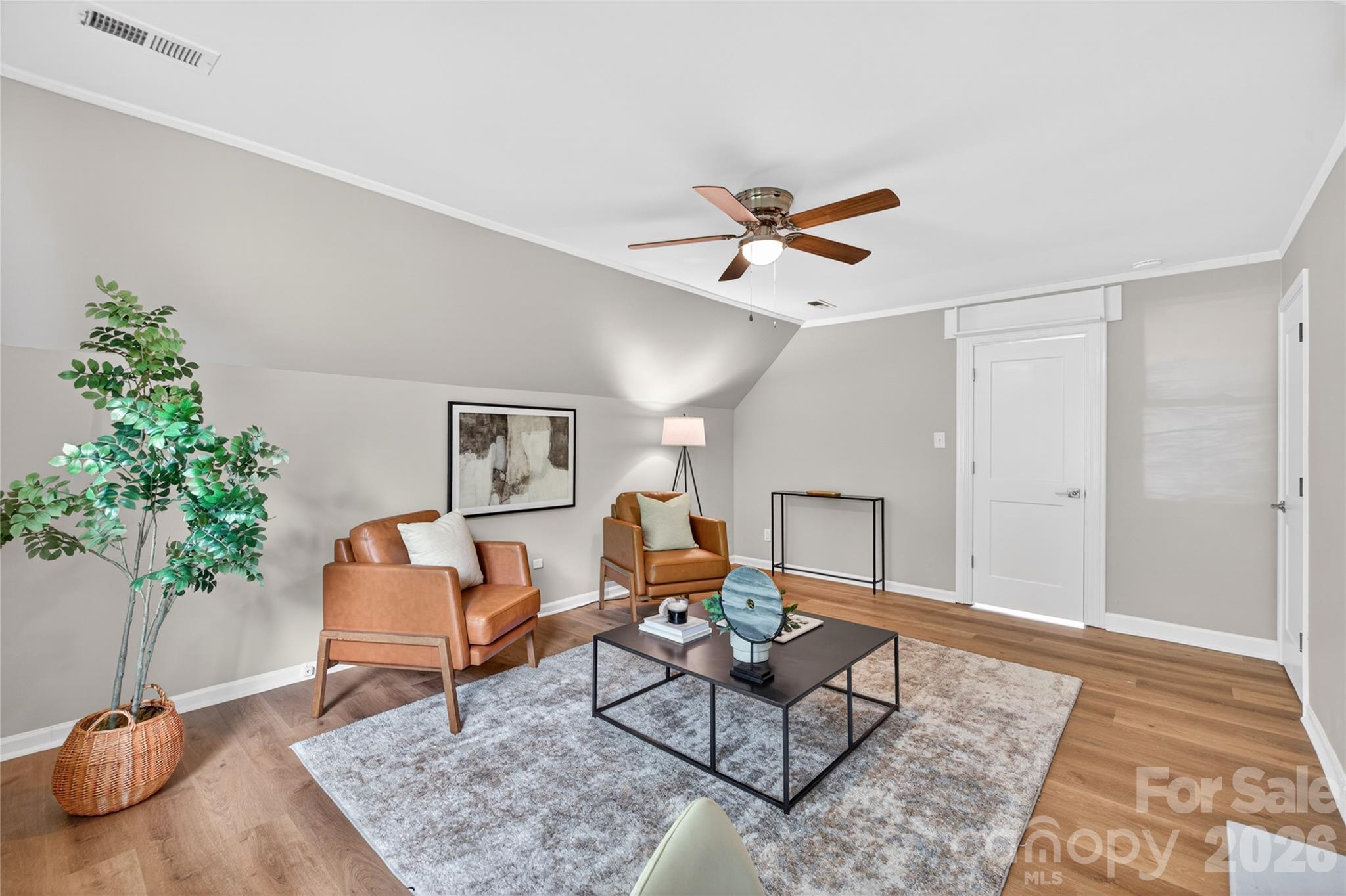 116 Middleton Avenue Matthews, NC 28104 - Photo 15 of 22 a living room with furniture and a potted plant