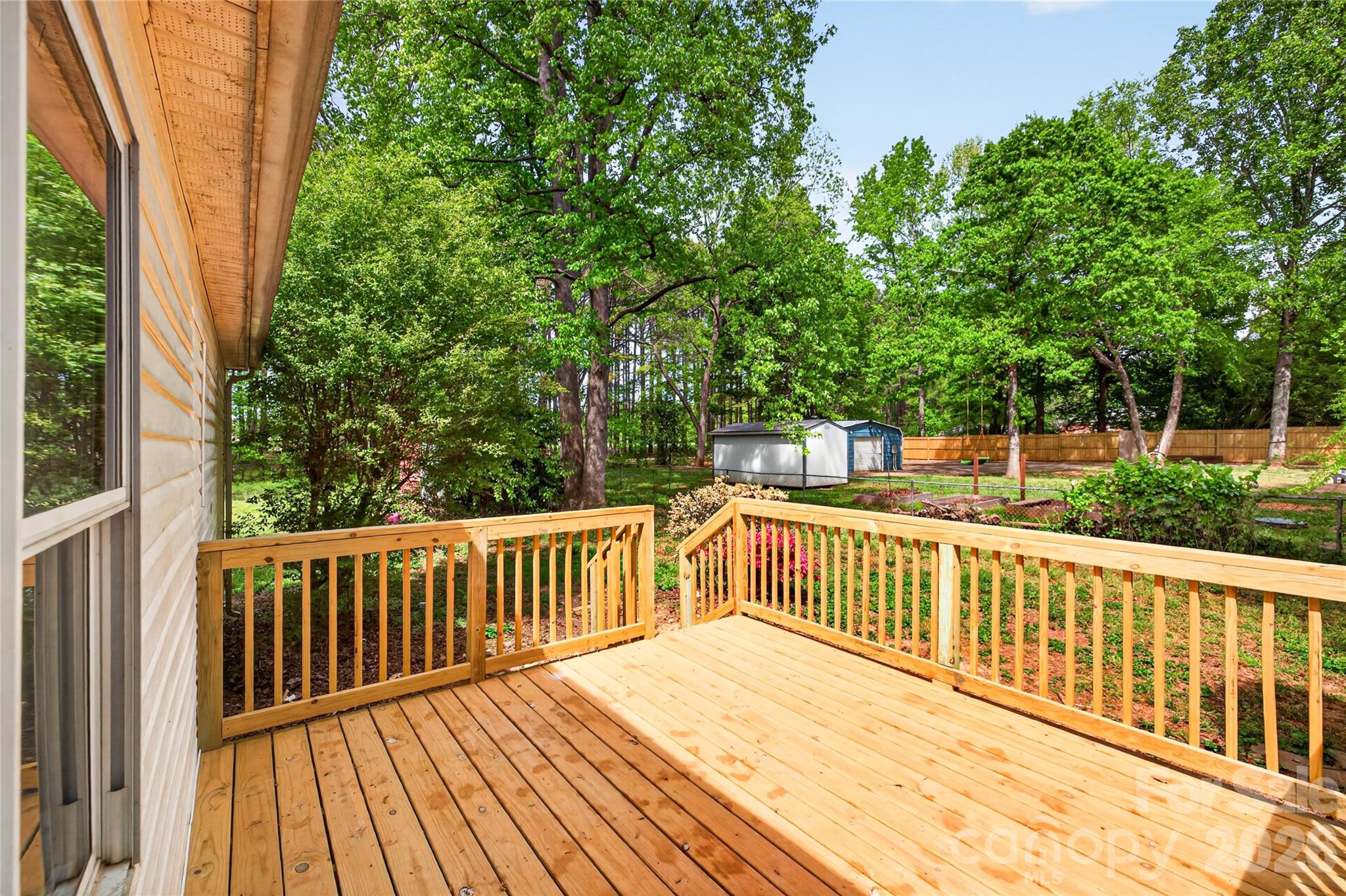 116 Middleton Avenue Matthews, NC 28104 - Photo 20 of 22 a view of deck with wooden floor and fence
