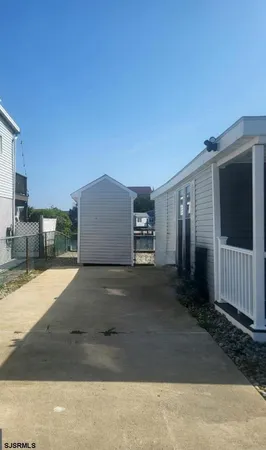 a view of a parking space in front of a house