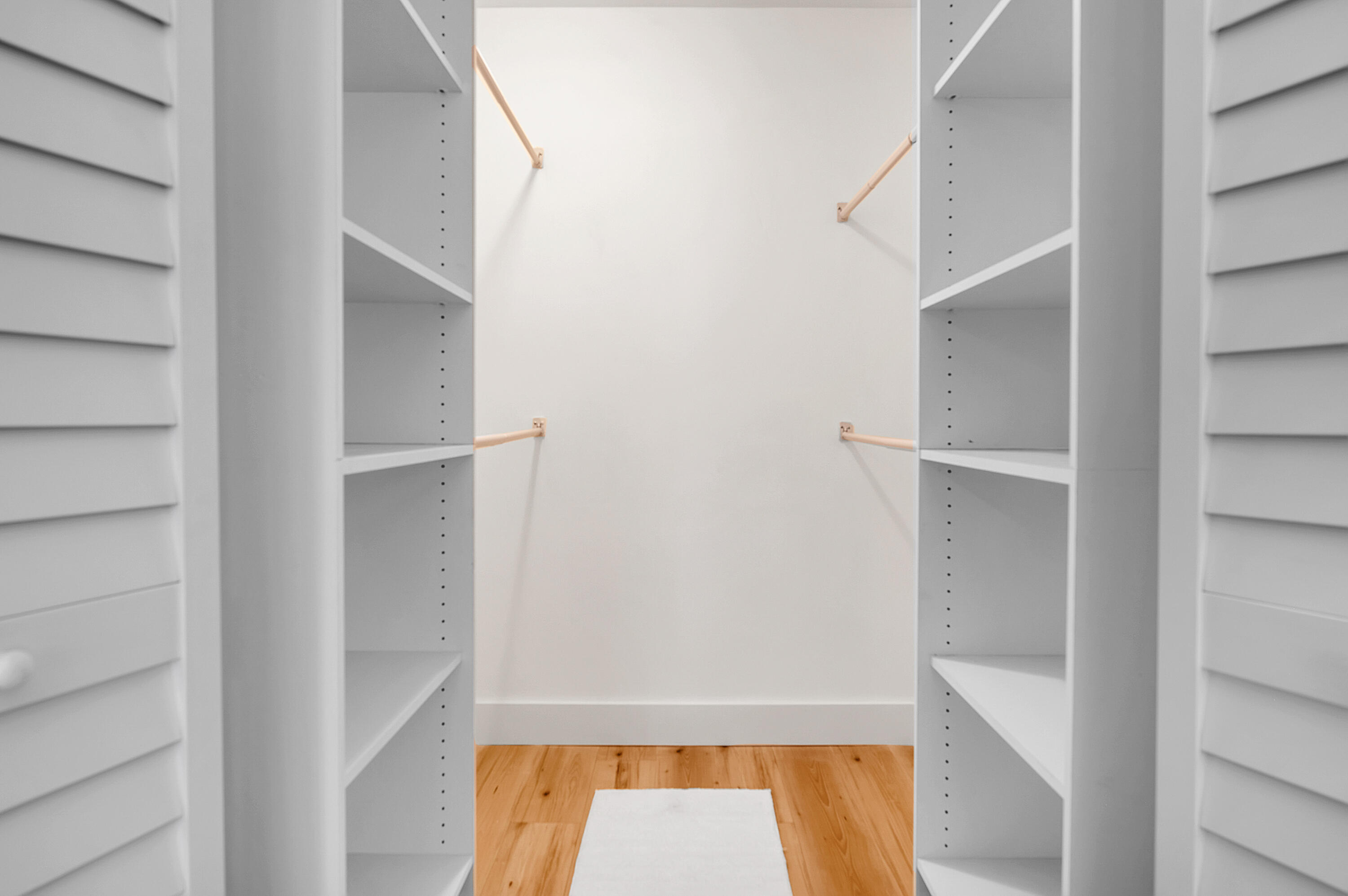 8799 Bella Vista Drive Boca Raton, FL 33433 - Photo 23 of 58 a view of walk in closet with empty racks