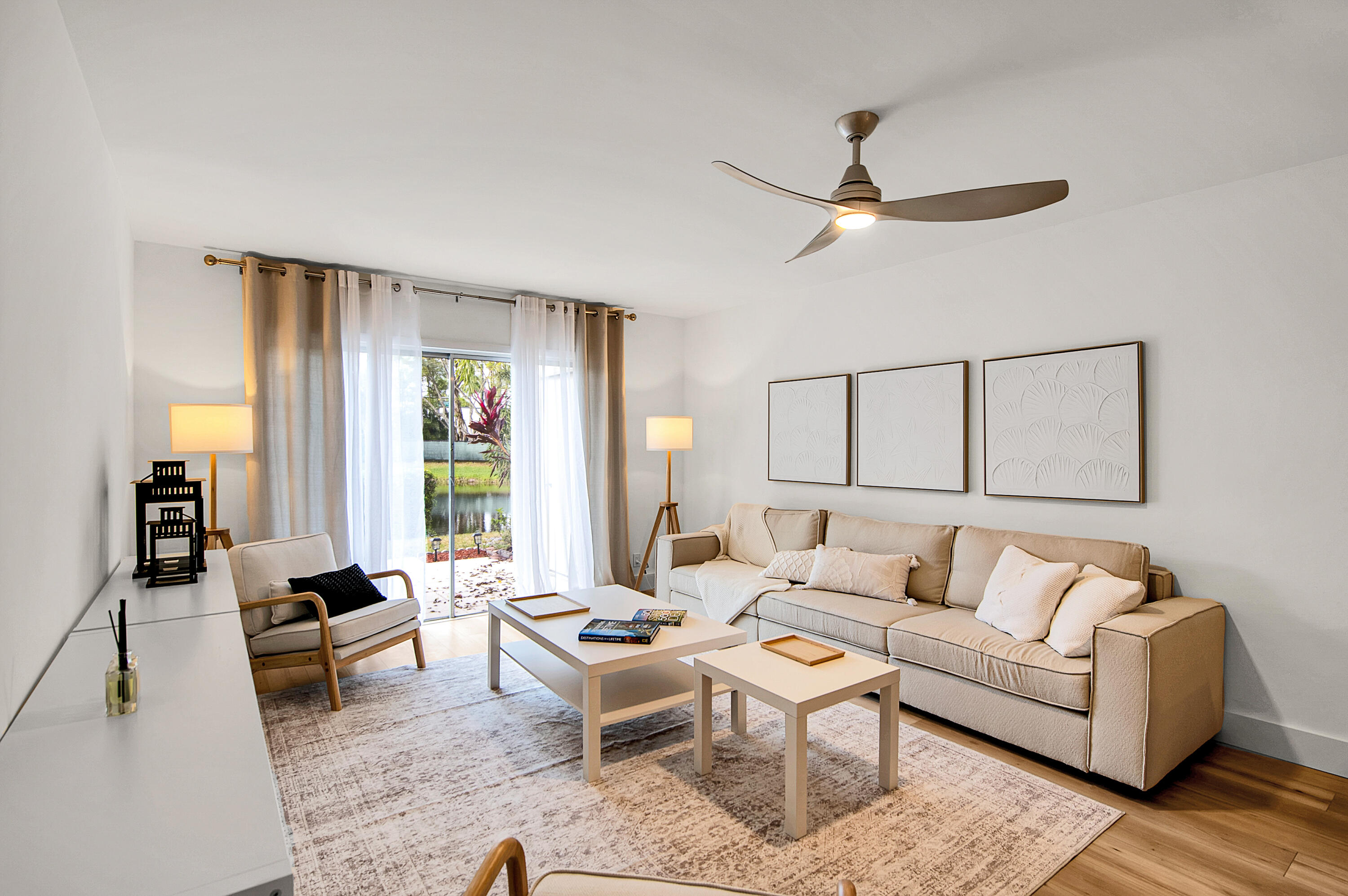 8799 Bella Vista Drive Boca Raton, FL 33433 - Photo 33 of 58 a living room with furniture and a large window