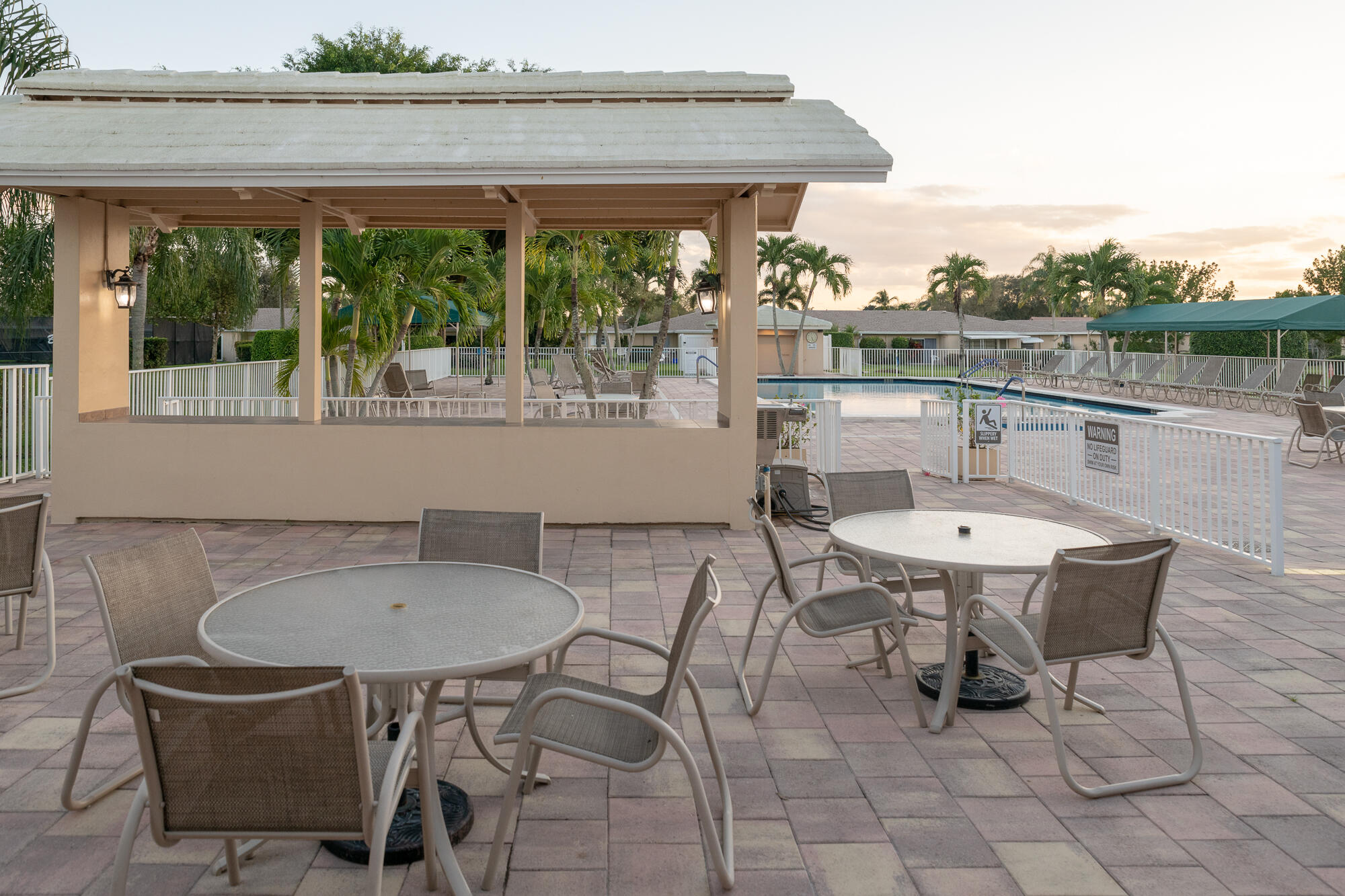 8799 Bella Vista Drive Boca Raton, FL 33433 - Photo 43 of 58 a outdoor dining space with furniture and a potted plant