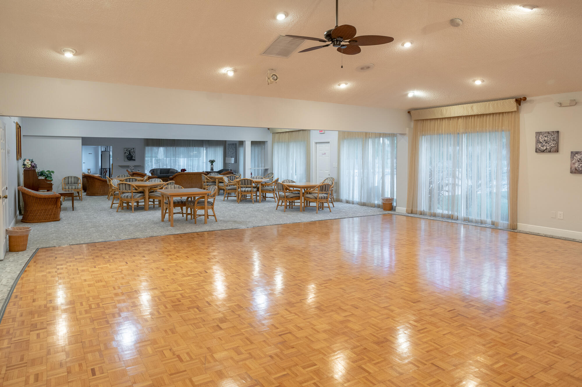 8799 Bella Vista Drive Boca Raton, FL 33433 - Photo 47 of 58 a living room with lots of furniture wooden floor and a kitchen view