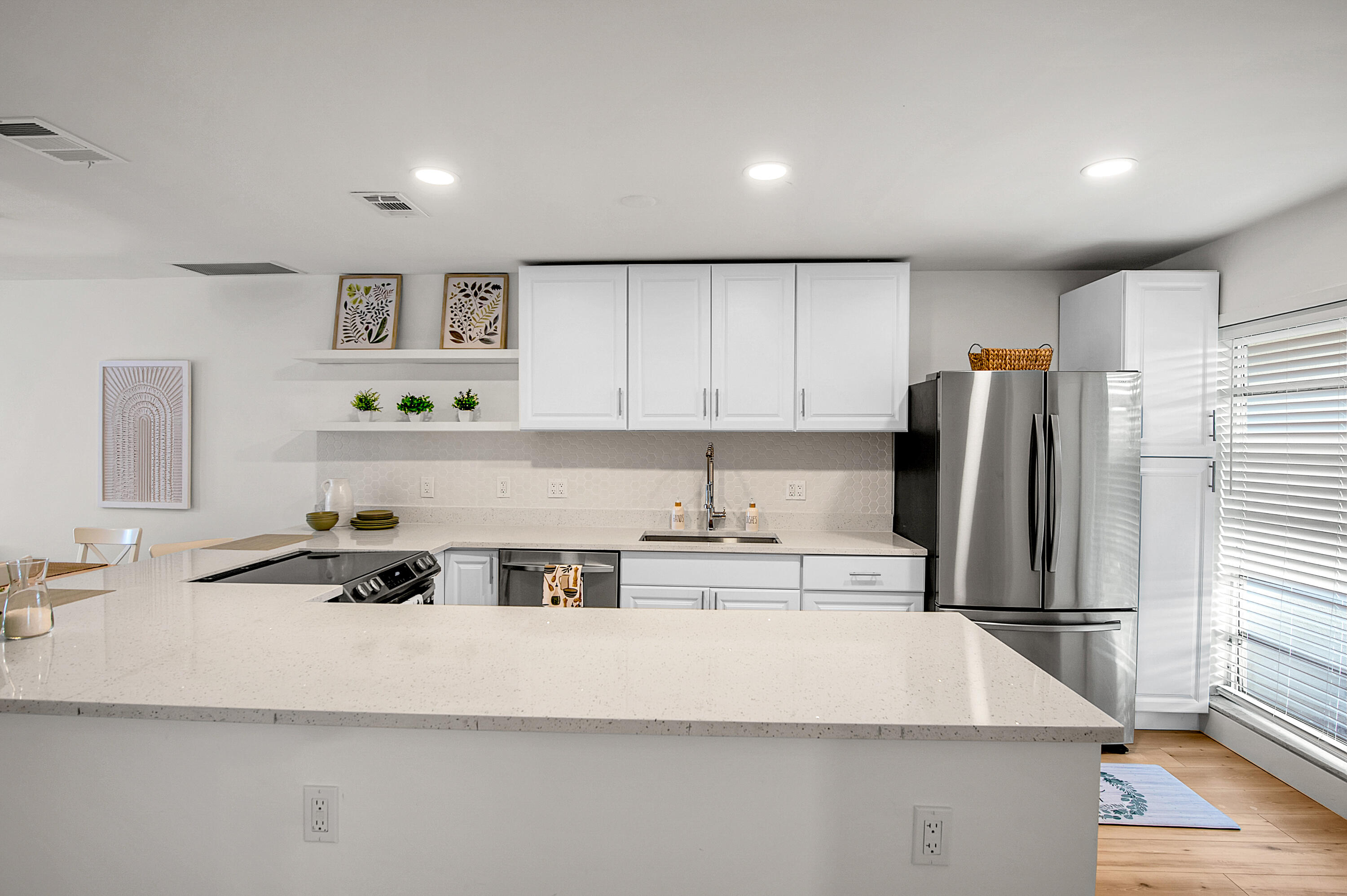 8799 Bella Vista Drive Boca Raton, FL 33433 - Photo 10 of 58 a kitchen with stainless steel appliances a refrigerator sink and cabinets