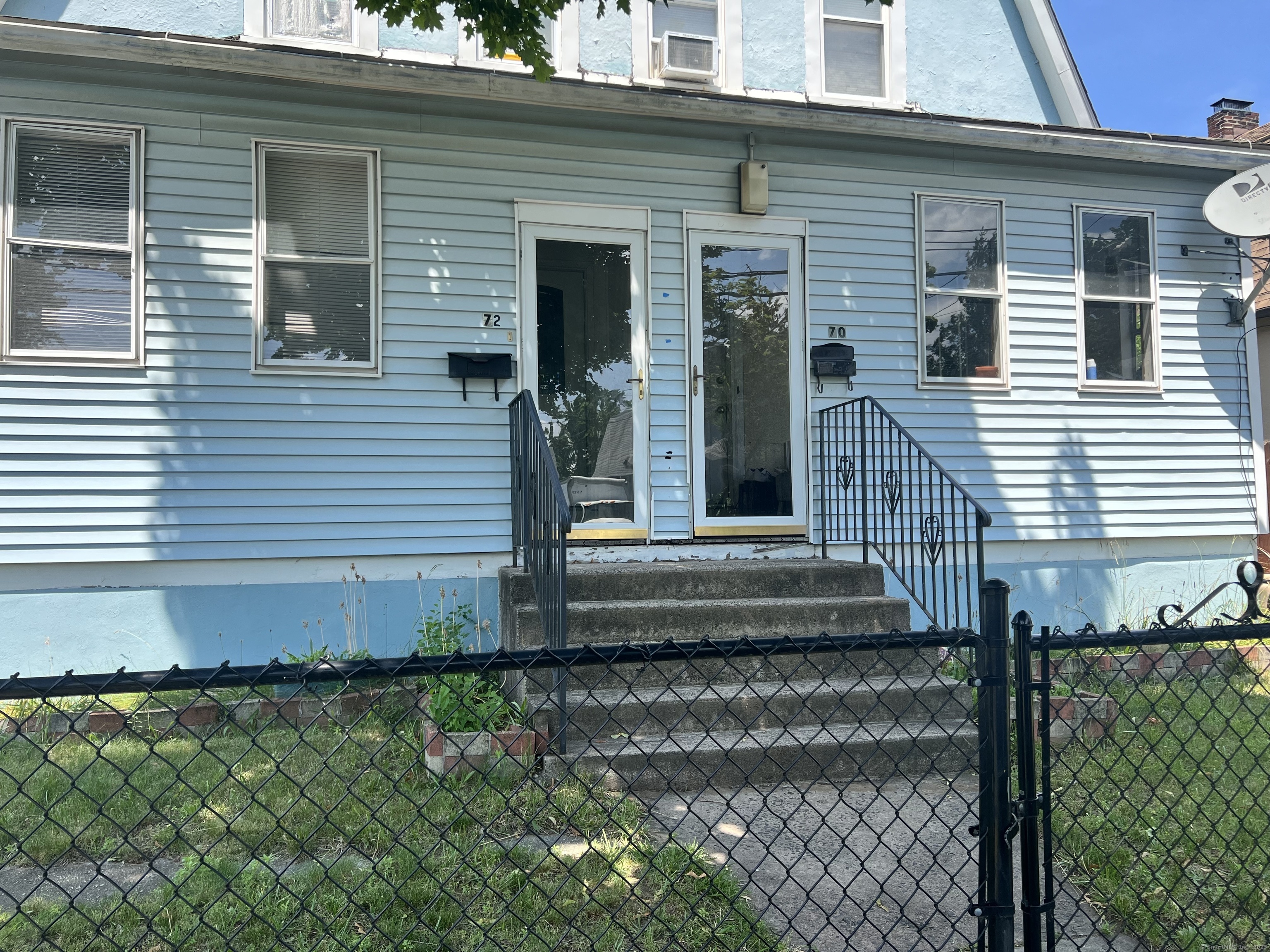 70 Burnham Street Hartford, CT 06112 - Photo 1 of 15 a front view of a house with a garden