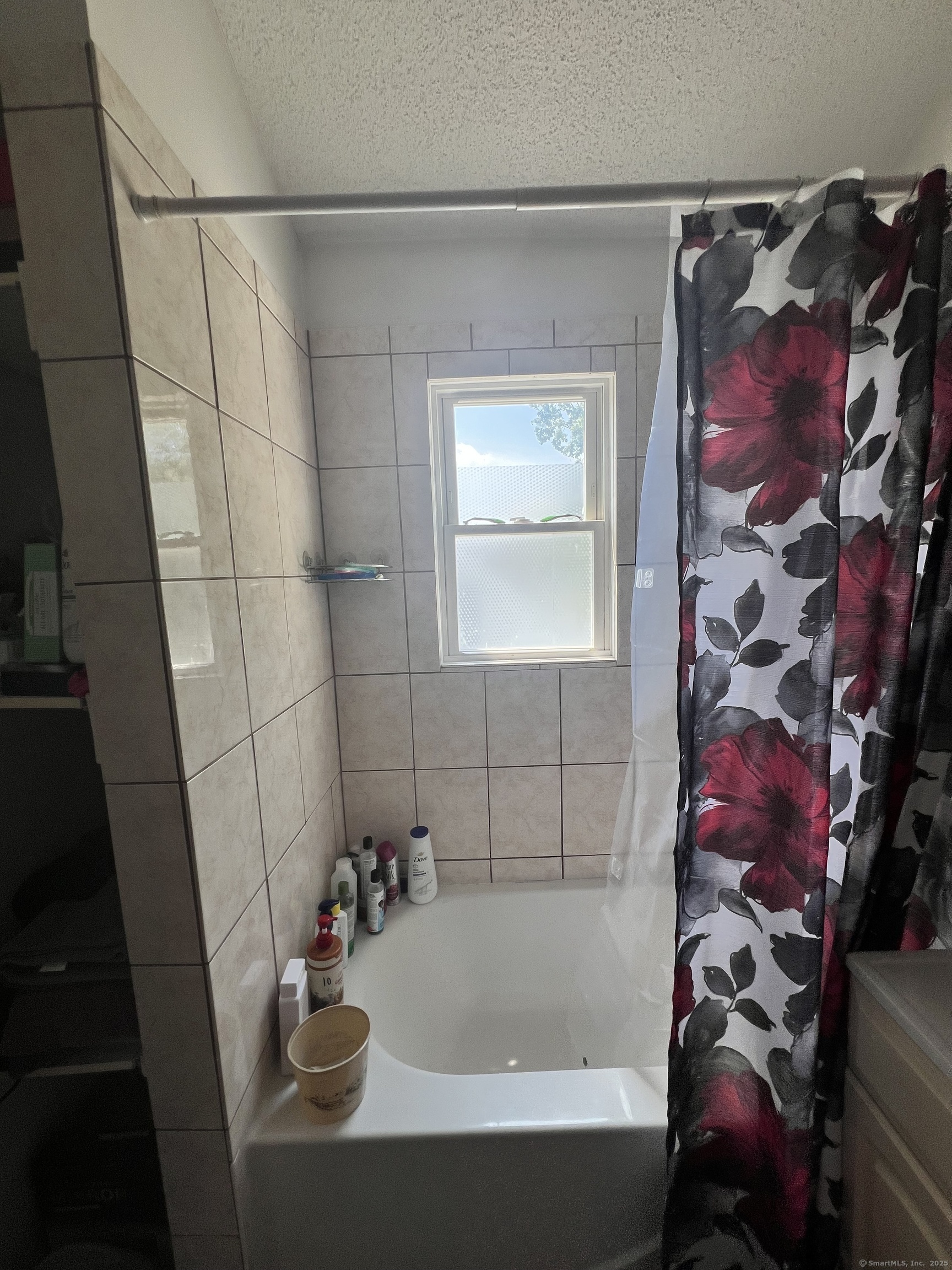 70 Burnham Street Hartford, CT 06112 - Photo 13 of 15 a bathroom with a sink and bathtub with shower curtain