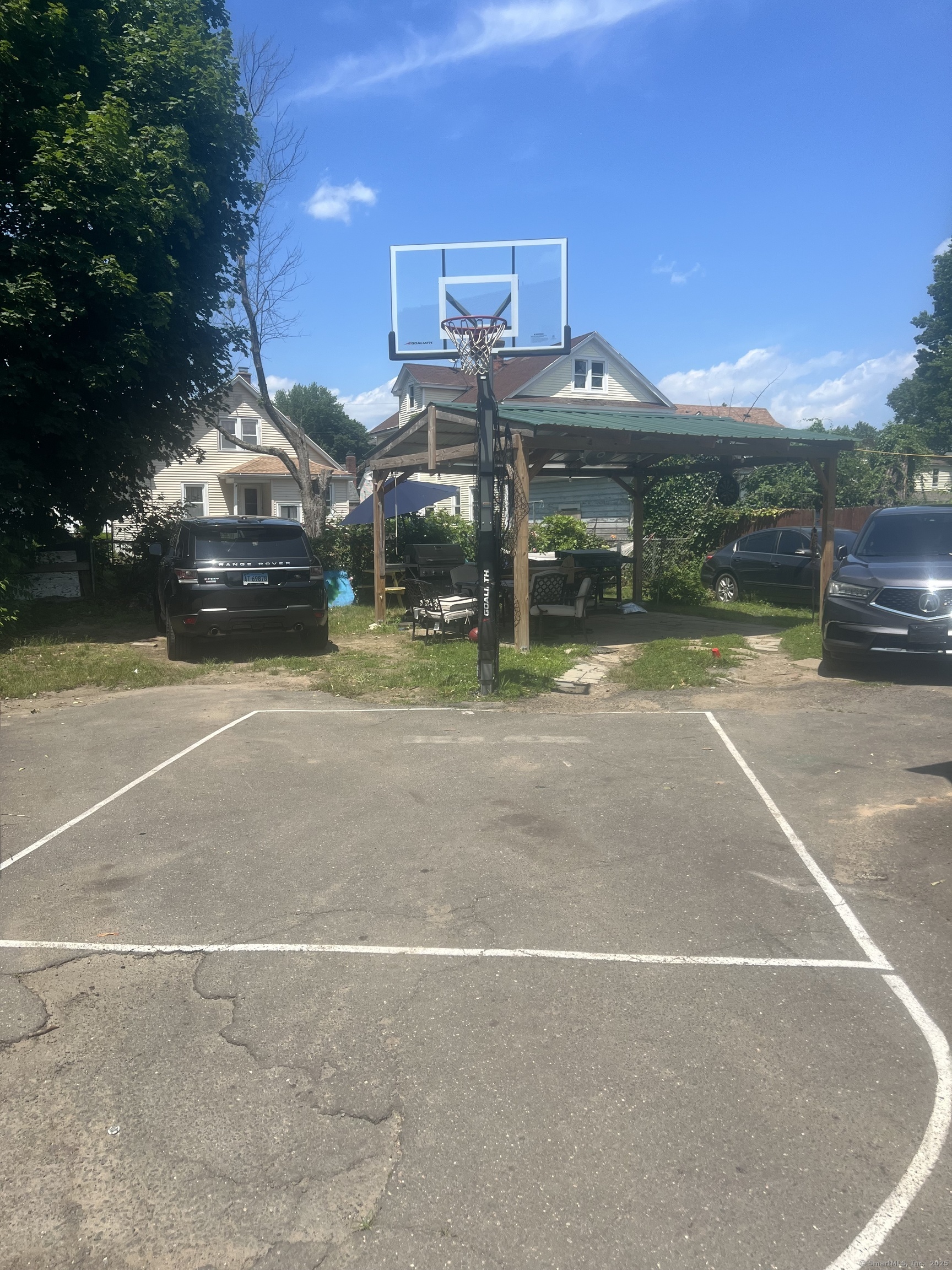 70 Burnham Street Hartford, CT 06112 - Photo 15 of 15 a roof deck with table and chairs under an umbrella