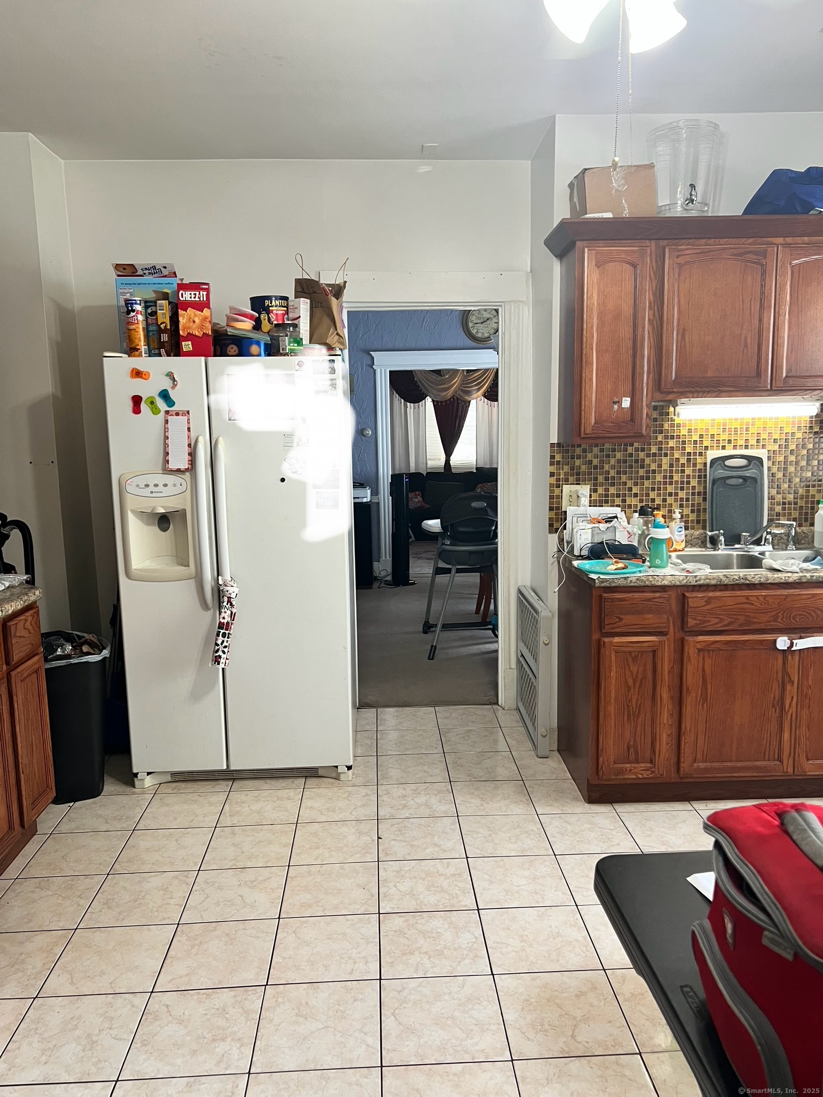 70 Burnham Street Hartford, CT 06112 - Photo 7 of 15 a kitchen with a refrigerator and a stove top oven