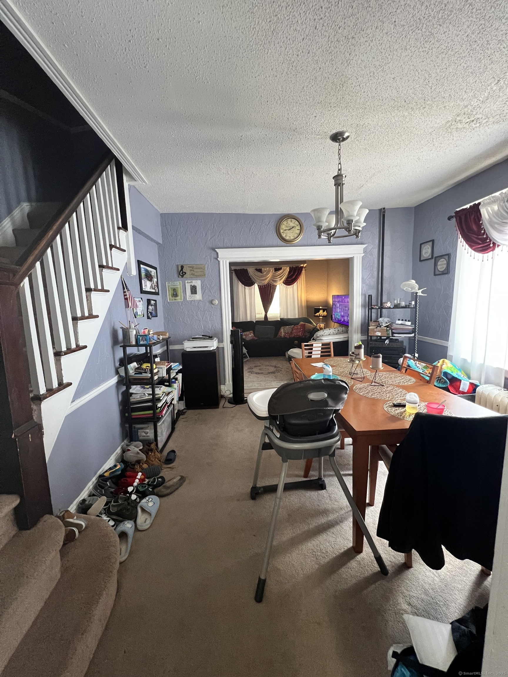 70 Burnham Street Hartford, CT 06112 - Photo 9 of 15 a room with furniture and a flat screen tv