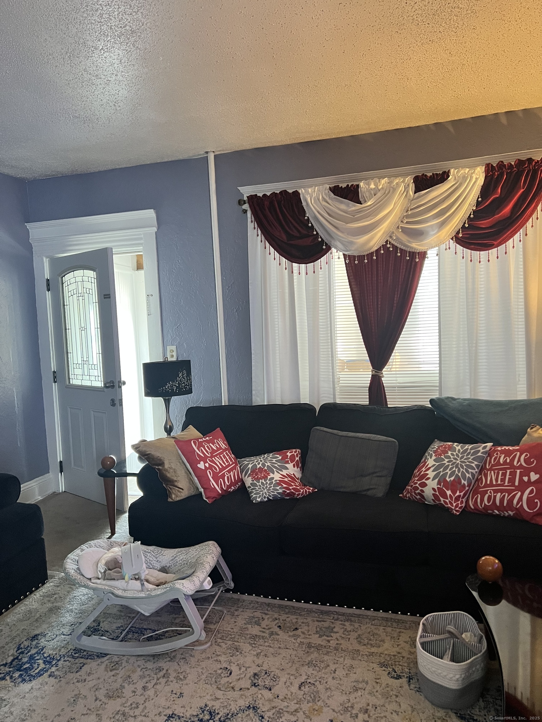 70 Burnham Street Hartford, CT 06112 - Photo 10 of 15 a living room with furniture and a lamp