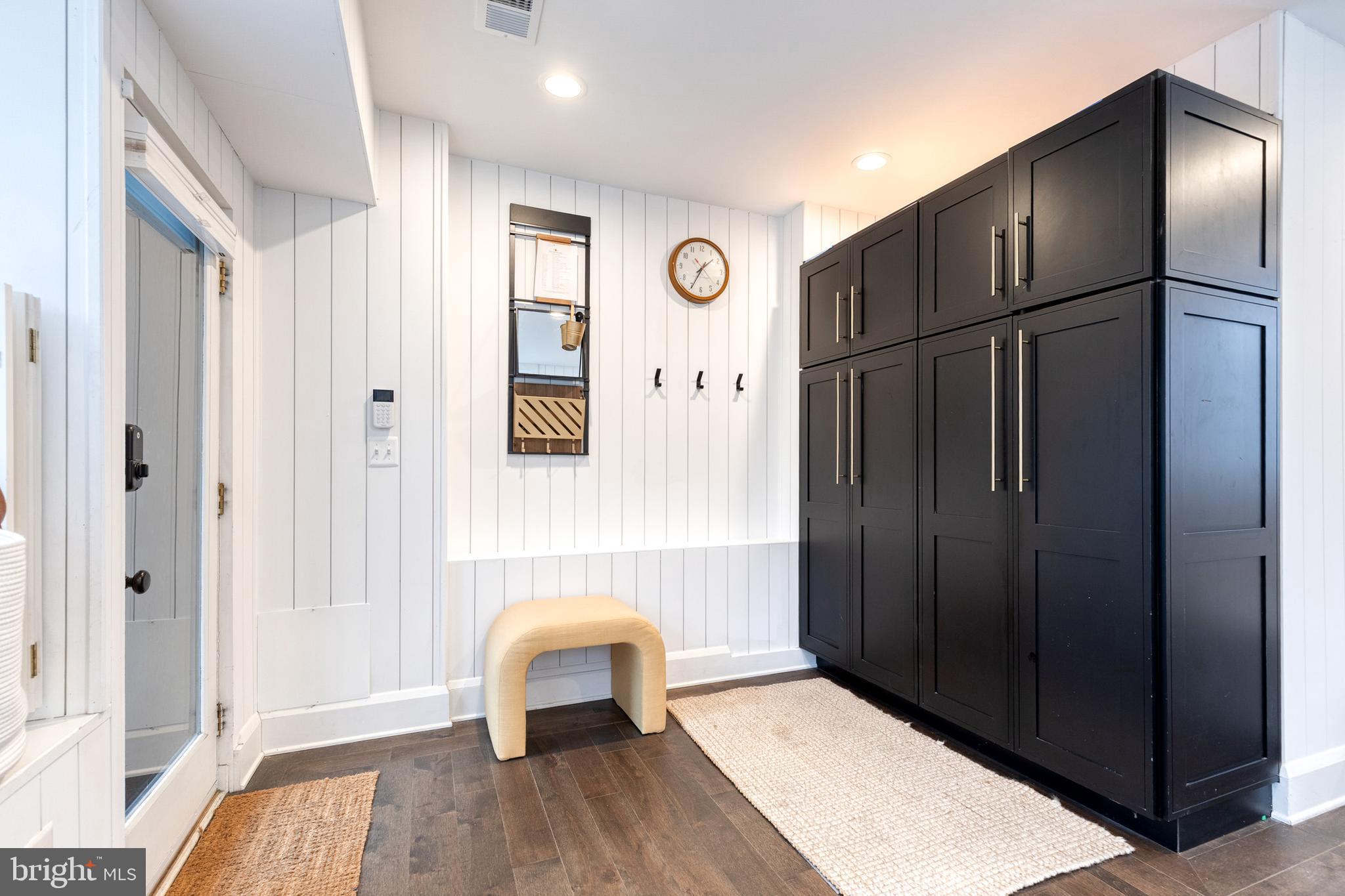 103 Witherspoon Road Baltimore, MD 21212 - Photo 30 of 62 an entryway at an empty room with wooden floor and a window