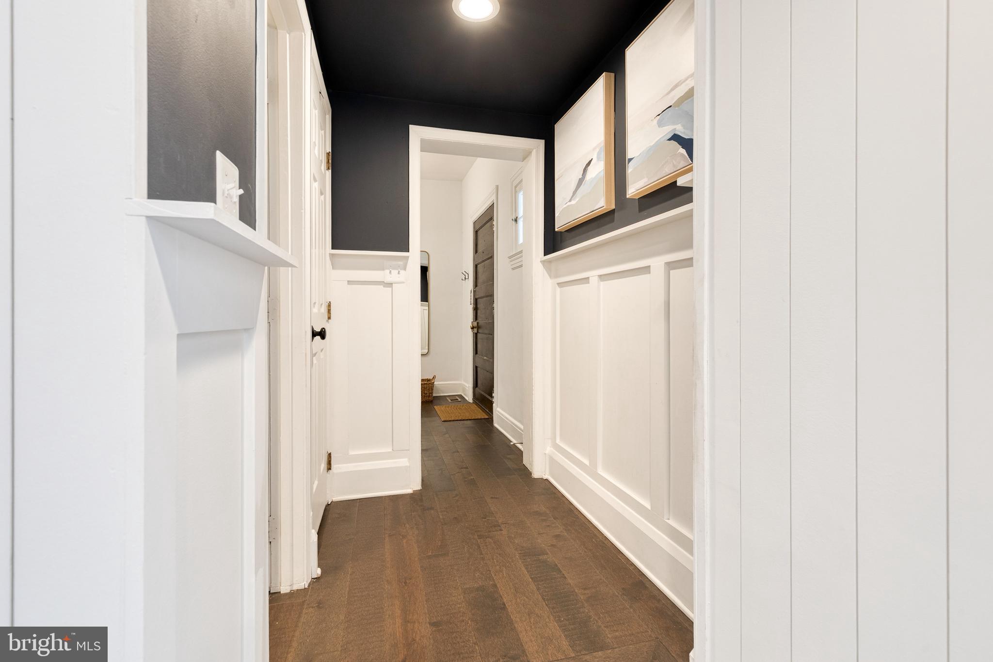 103 Witherspoon Road Baltimore, MD 21212 - Photo 32 of 62 a view of a hallway with wooden floor and entryway