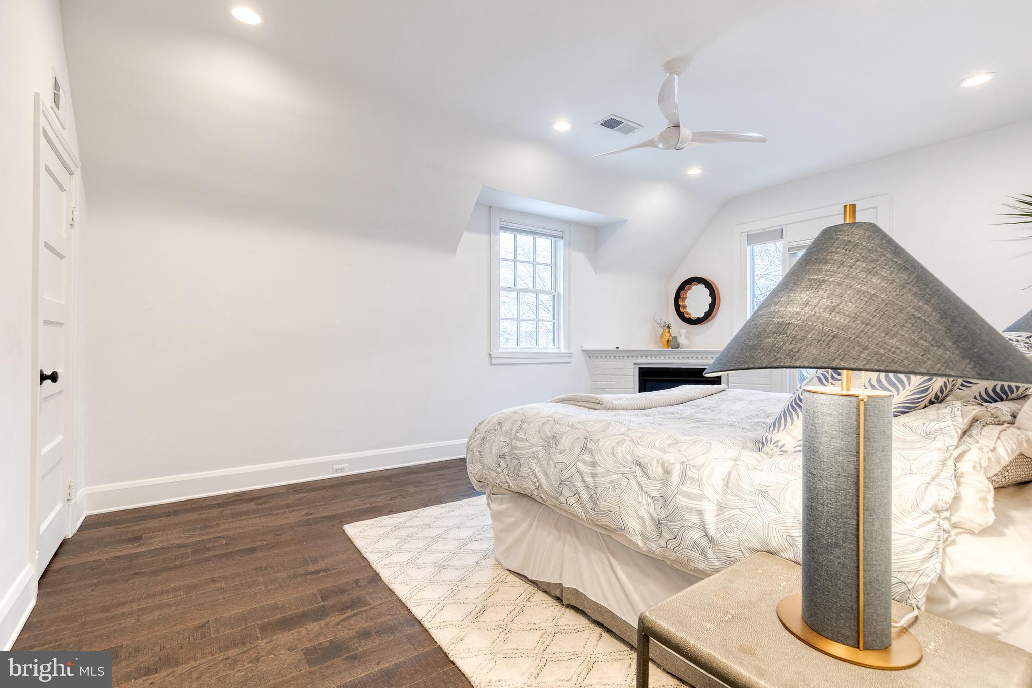 103 Witherspoon Road Baltimore, MD 21212 - Photo 34 of 62 a bedroom with a bed and a chandelier