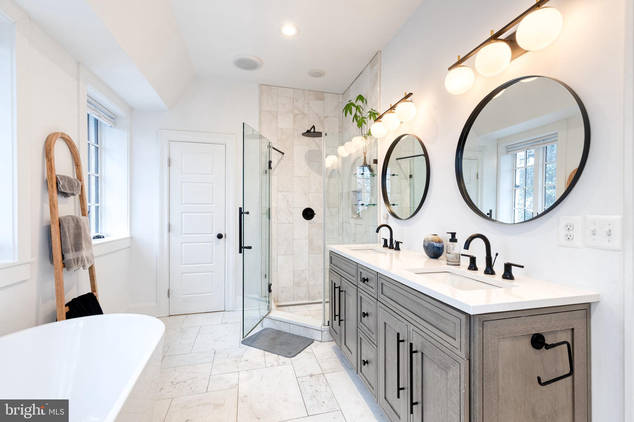 103 Witherspoon Road Baltimore, MD 21212 - Photo 38 of 62 a bathroom with a double vanity sink and a mirror