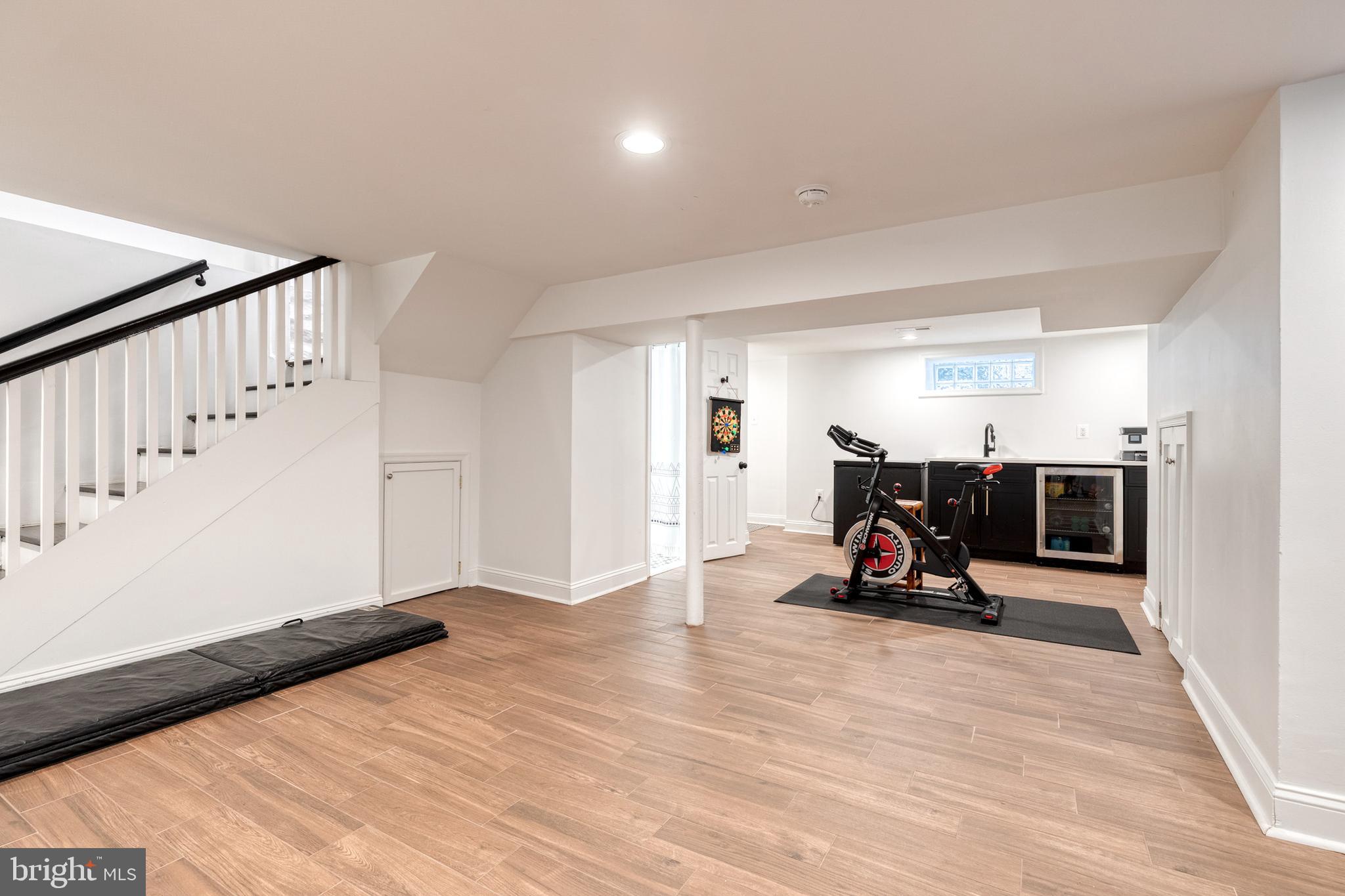 103 Witherspoon Road Baltimore, MD 21212 - Photo 58 of 62 a view of a room with wooden floor and windows