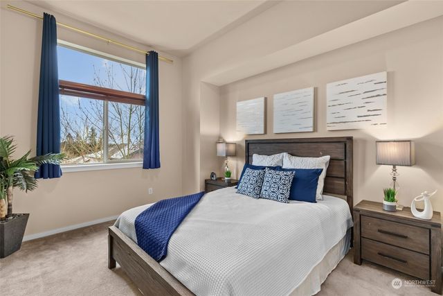 a bedroom with a bed and window