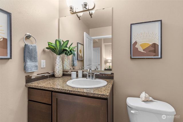 a bedroom with a bed couch and window