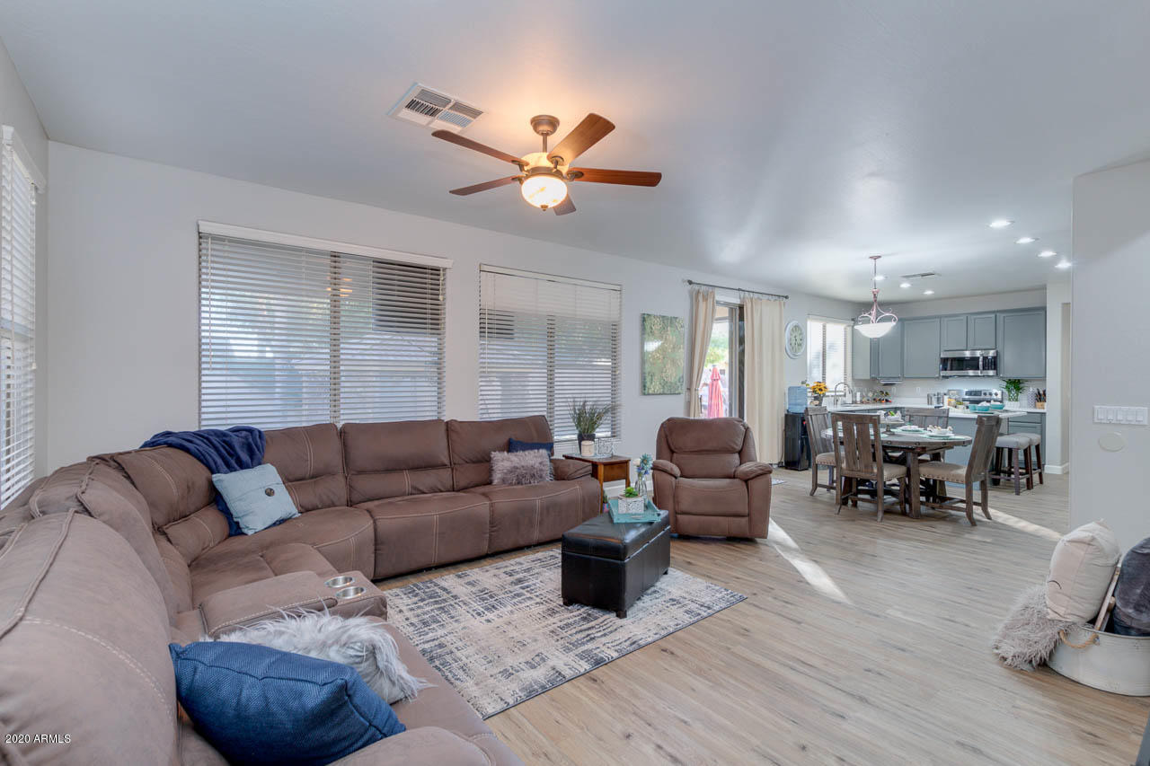 3315 East Los Altos Road Gilbert, AZ 85297 - Photo 13 of 66 a living room with furniture and wooden floor