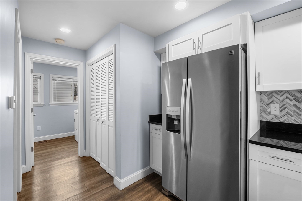 15 R Argyle Street Revere, MA 02151 - Photo 14 of 32 a metallic refrigerator freezer sitting inside of a kitchen