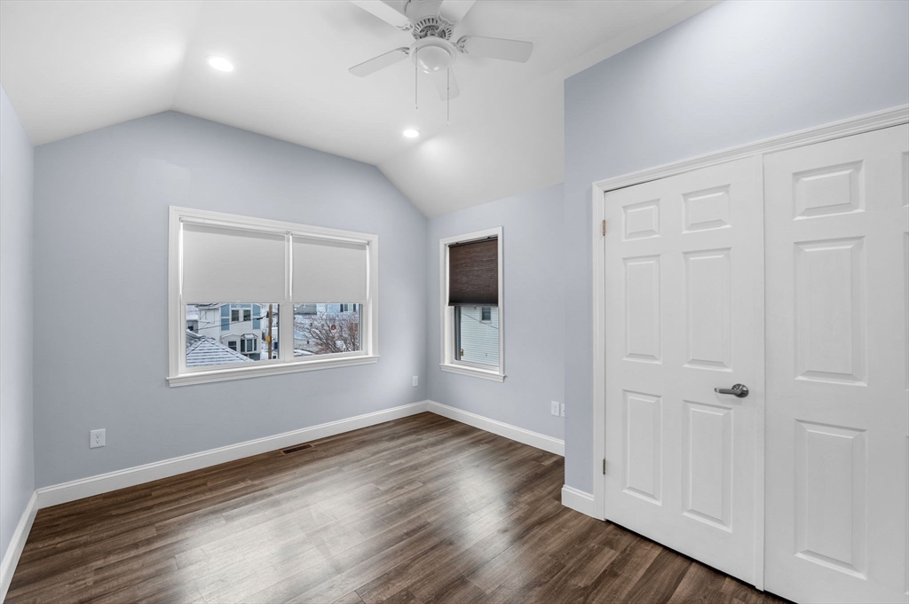 15 R Argyle Street Revere, MA 02151 - Photo 25 of 32 an empty room with wooden floor and windows