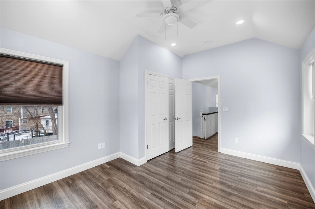 15 R Argyle Street Revere, MA 02151 - Photo 27 of 32 a view of an empty room with a window and wooden floor
