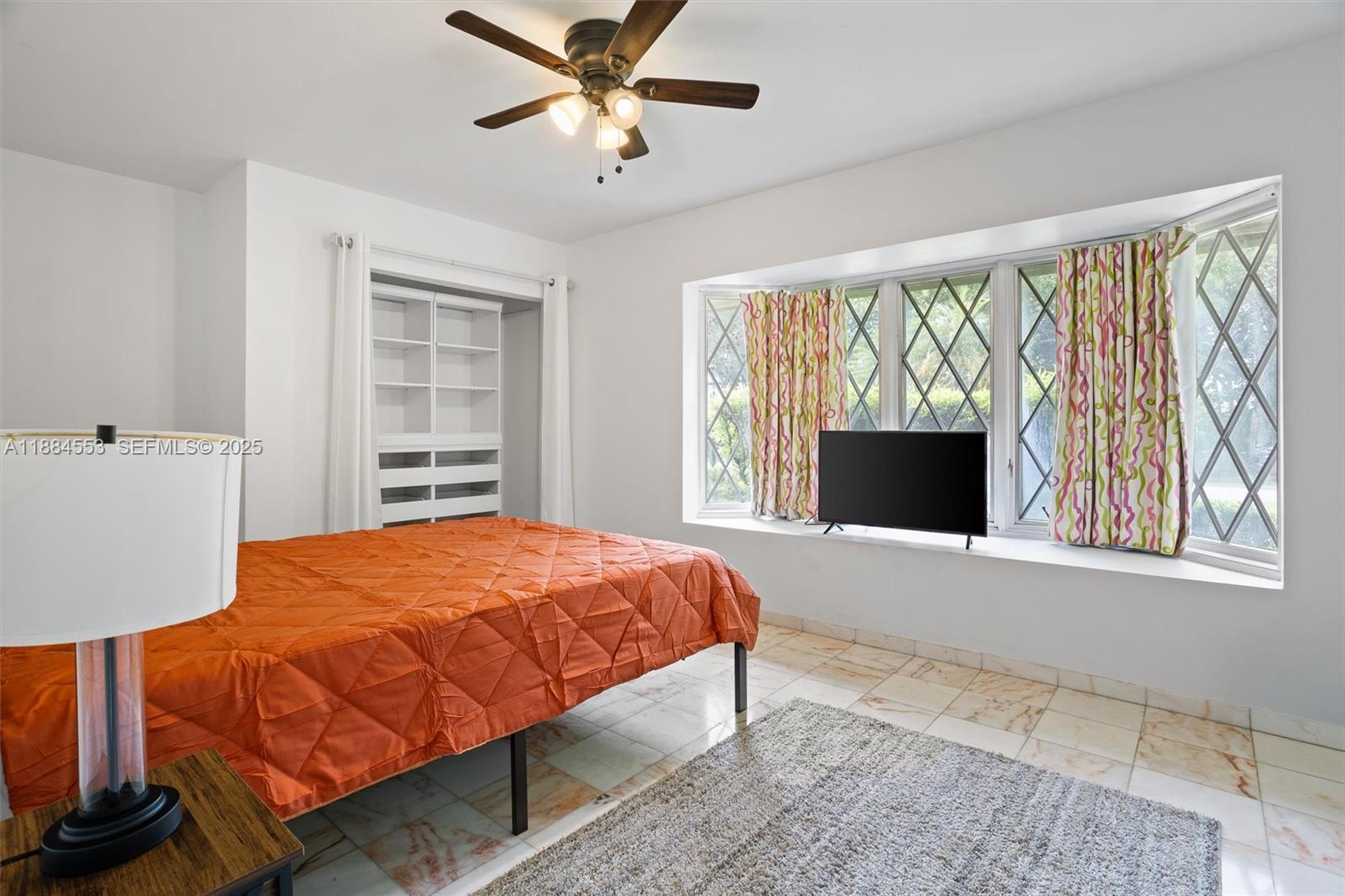 9031 North New River Canal Road Plantation, FL 33324 - Photo 16 of 33 a bedroom with a bed and a window