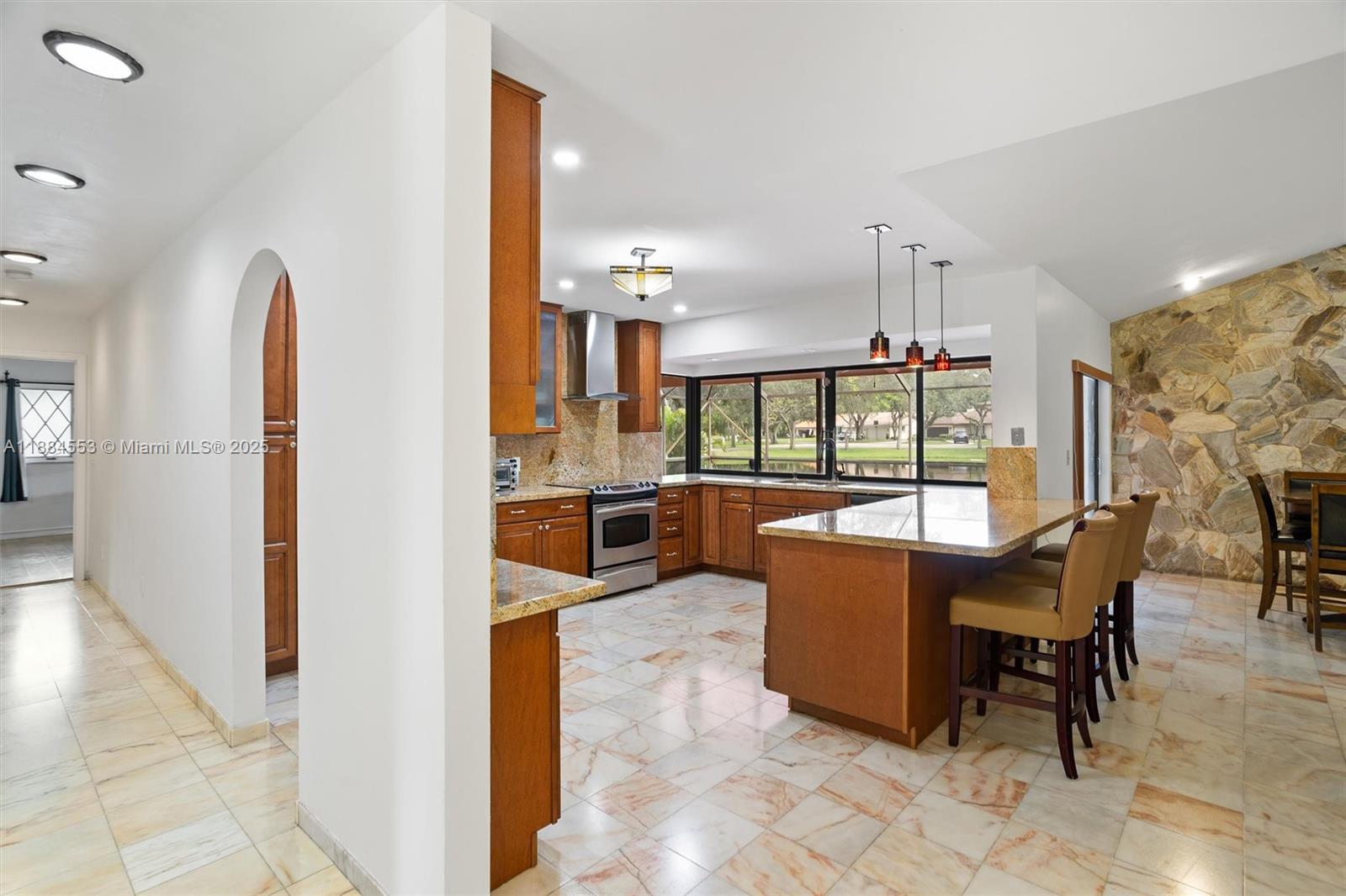 9031 North New River Canal Road Plantation, FL 33324 - Photo 7 of 32 a dining room with furniture and a floor to ceiling window
