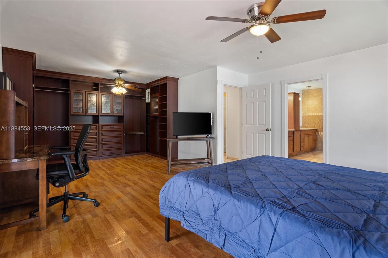 9031 North New River Canal Road Plantation, FL 33324 - Photo 10 of 33 a bedroom with a bed and a view of kitchen