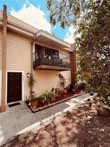 a view of a car park in front of house