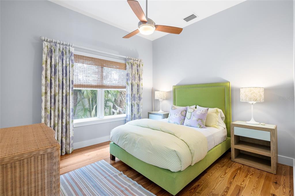 340 Palm Avenue Boca Grande, FL 33921 - Photo 18 of 38 a bedroom with a bed and a window