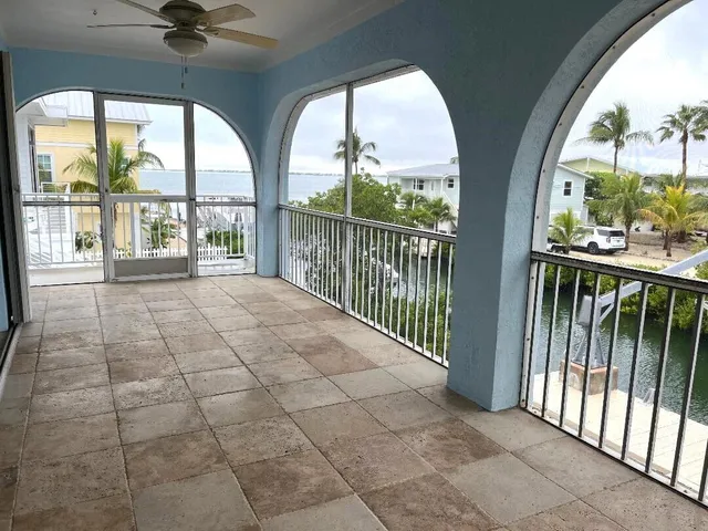 a view of a porch with a floor to ceiling window