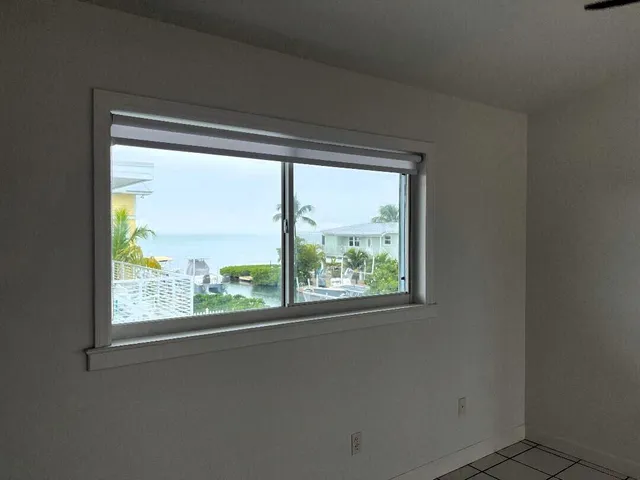 a view of an empty room and window