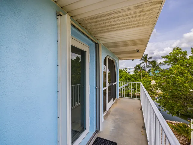 a view of a porch with wooden floor and outdoor space