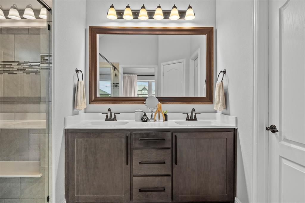1084 Imperial Eagle Road Alvarado, TX 76009 - Photo 24 of 39 a bathroom with sinks mirror and vanity
